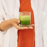 Person Holding Clear Drinking Glass Of Fresh Smoothie